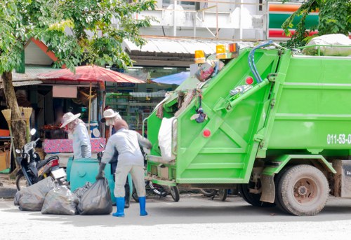 Manager reviewing a free quote for man and van waste removal in Holborn